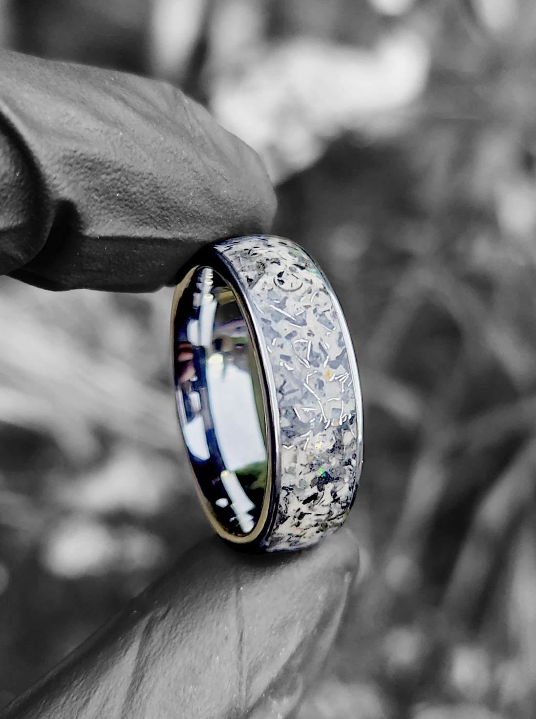 Showcase the intricate lunar-inspired design with the alt text: "Bespoke Space, Once in A Blue Moon Ring: A unique meteorite-infused ring that captures the essence of the celestial moon.